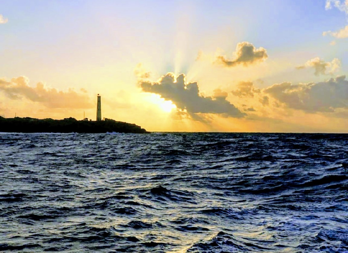 Sunrise view of a tugboat off Kauai