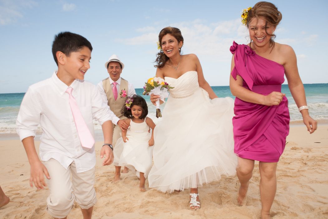 Family enjoying Hawaii wedding on the beach