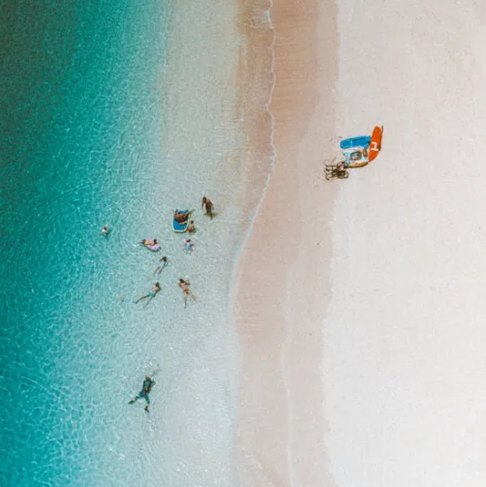 Unlike Kona, which is known for white-sand beaches, Hilo’s beaches are unique—think black sand, lava rock tide pools, and calm snorkeling spots where sea turtles are frequent visitors.