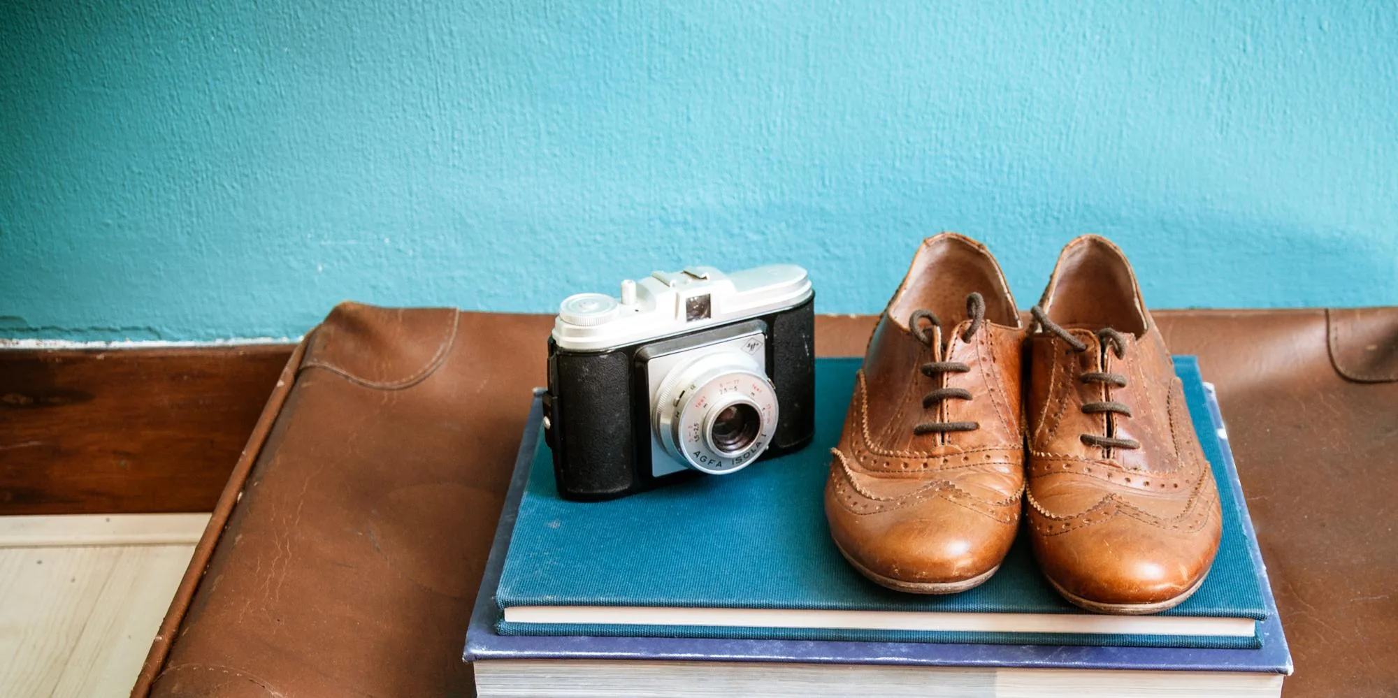 vintage still life with suitcase and shoes vintage still life with suitcase and shoes
