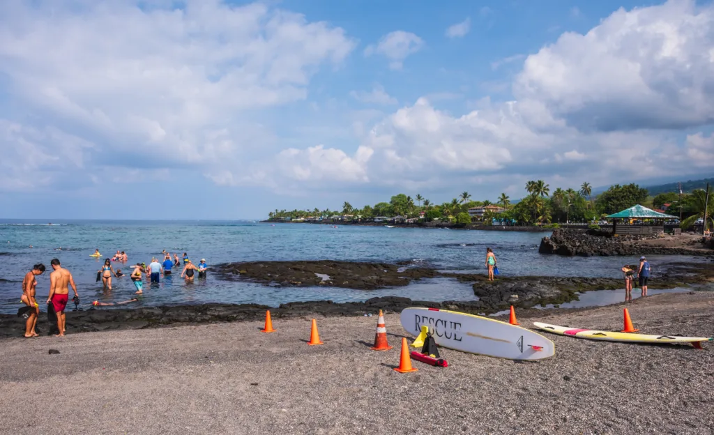 Snorkelers entering the shallow reef at Kahaluu Beach Park near Kailua-Kona